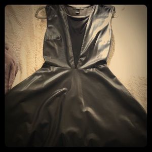 A fun and flirty leather dress with a mesh back.